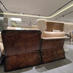 Warm Sand Leather Sofa Set with Natural Burl Wood Veneer, Polished Stainless Steel Trim & Fluid Curved Silhouette